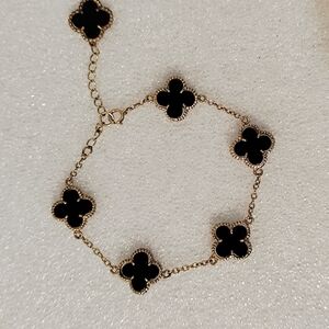 Elegant Black and Gold Clover Bracelet